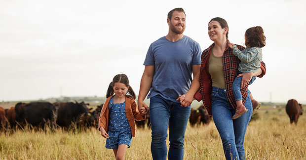 Family walking in field