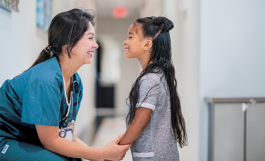 Provider and pediatric patient smiling