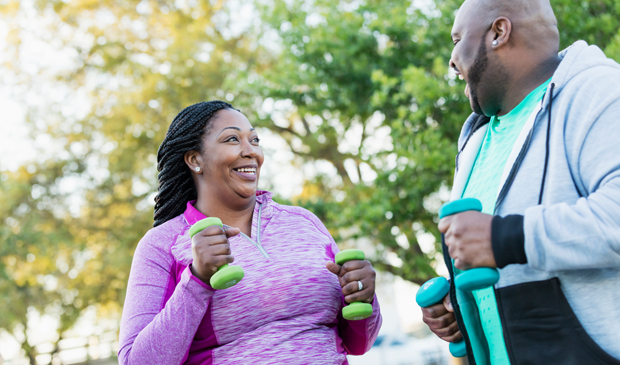 African American couple exercising outside