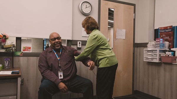 Rescue Mission patient getting blood pressure taken